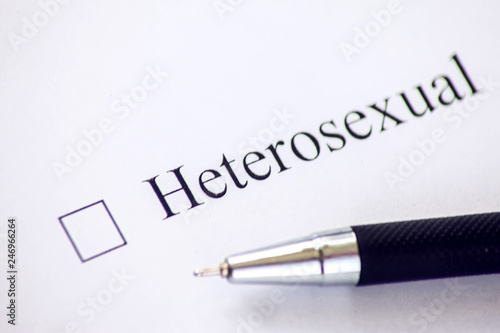 Checklist with a word Heterosexual on white paper. Checkbox concept.
