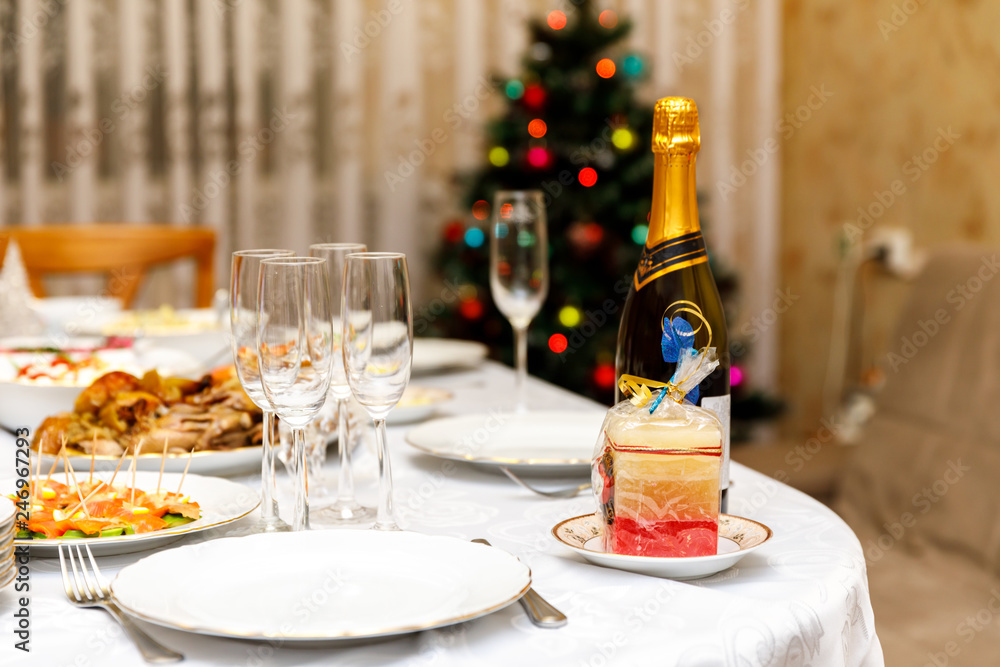 New Year in Russia, a feast with champagne and salad. How much are New Year's dishes