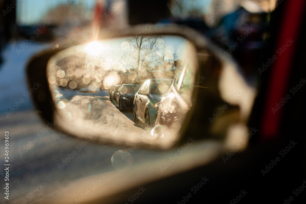 reflection of traffic flow in left side rear view mirror at twilight time reflection of traffic flow in left side rear view mirror at twilight time