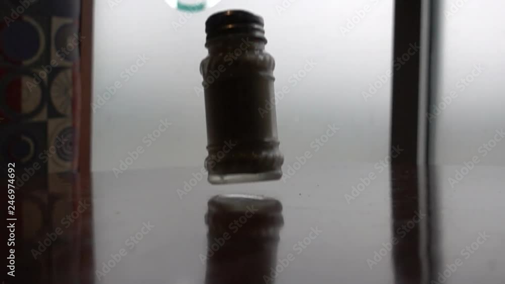 Super Slow Motion Falling Pepper Shaker On Table In Restaurant Super Slow Motion Falling Pepper Shaker On Table In Restaurant