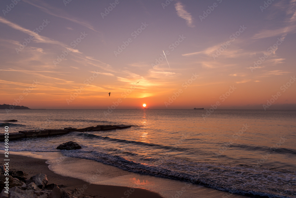 Fototapeta premium Early autumn sea sunrise at the beach.