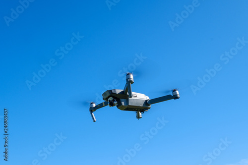 Fototapeta Naklejka Na Ścianę i Meble -  Folding drone flying in a sky