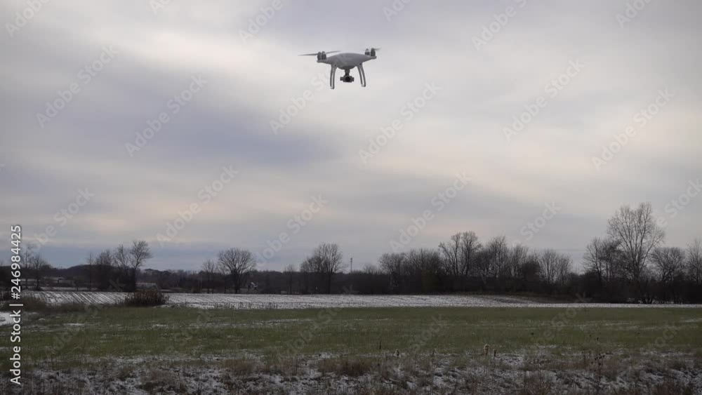 4 K Drone Hovering Above Grass Then Flying Off To Right 4 K Drone Hovering Above Grass Then Flying Off To Right