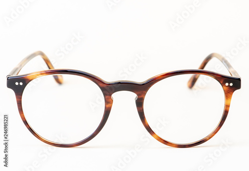 Brown styled glasses close-up isolated on white background 