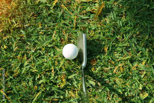 Golf ball on green in the evening golf course with sunshine in thailand