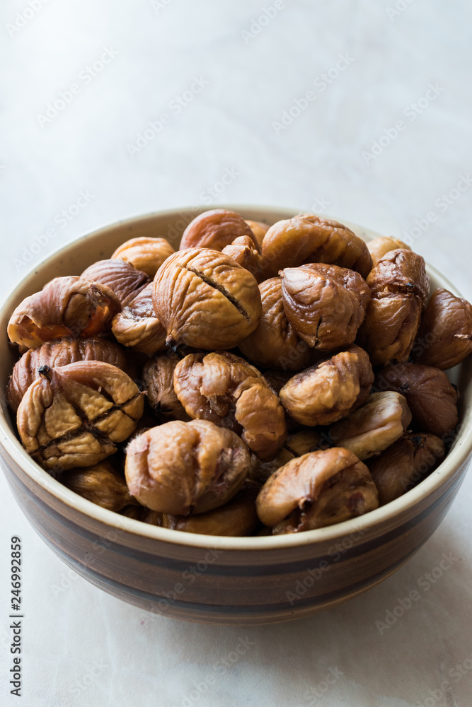 Peeled Roasted Raw Organic Chestnuts in Bowl. Peeled Roasted Raw Organic Chestnuts in Bowl.