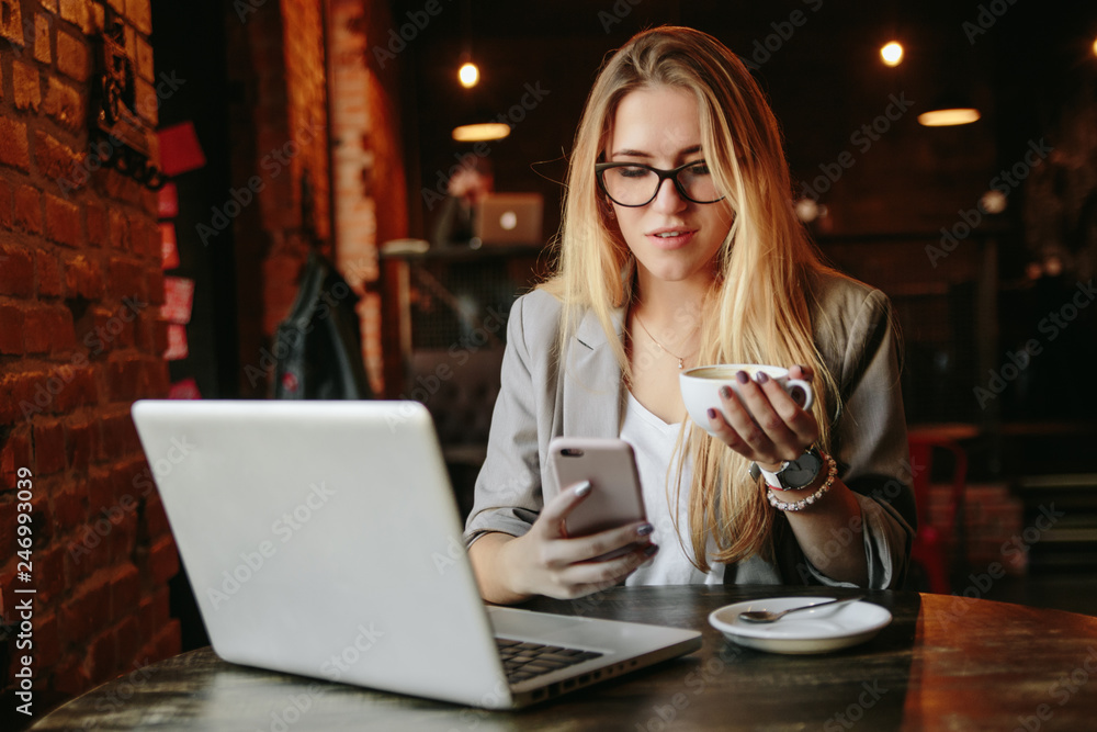 Young business woman working in cafe Young business woman working in cafe