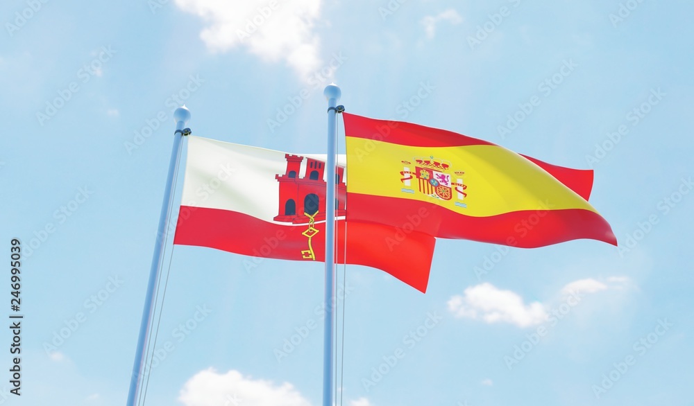 Spain and Gibraltar, two flags waving against blue sky. 3d image Spain and Gibraltar, two flags waving against blue sky. 3d image