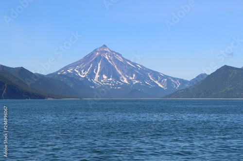 View of Vilyuchinsky volcano (also called Vilyuchik) from tourist boat. It's a stratovolcano in the southern part of Kamchatka Peninsula, Russia.