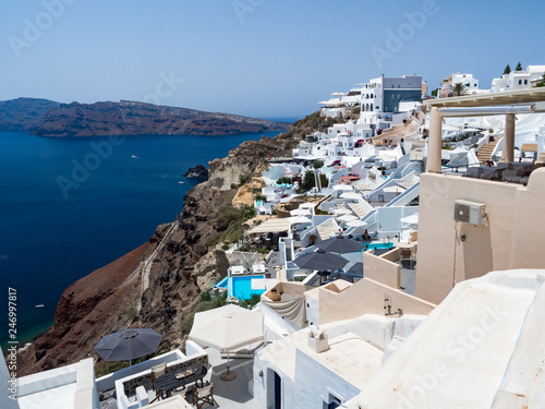Greece. Breathtaking beautiful landscape of houses and fascinating blue water in village on Santorini Greek island in Aegean sea. June, 2018