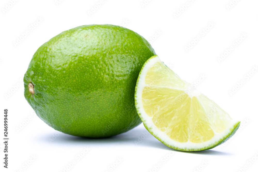 Whole and slice of fresh green lime isolated on white background. Citrus and tropical fruits Whole and slice of fresh green lime isolated on white background. Citrus and tropical fruits