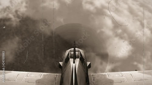 Fighter Airplane from WW2 in flight in the sky - POV view  - old vintage movie loock