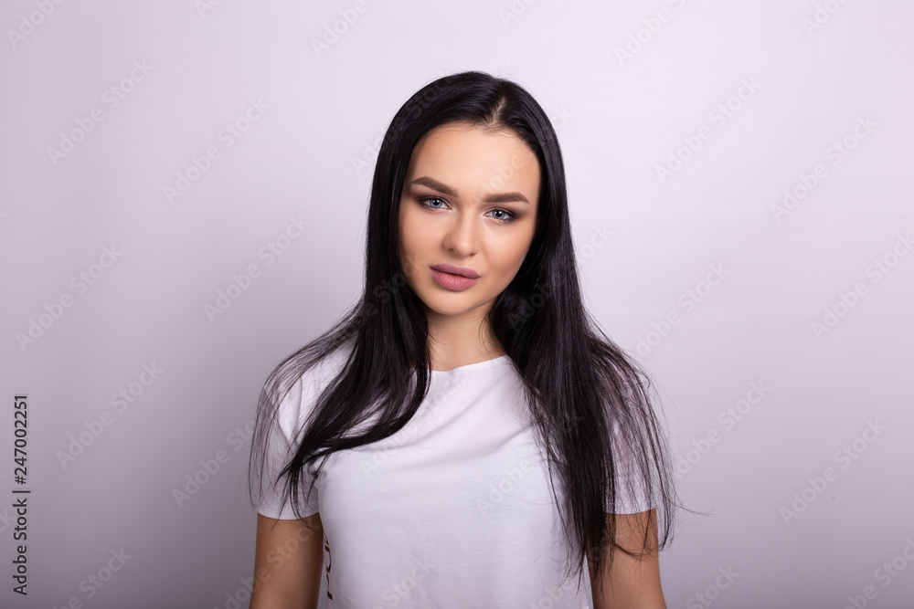 Beautiful smiling woman with clean skin, natural make-up. Isolated on white background Beautiful smiling woman with clean skin, natural make-up. Isolated on white background