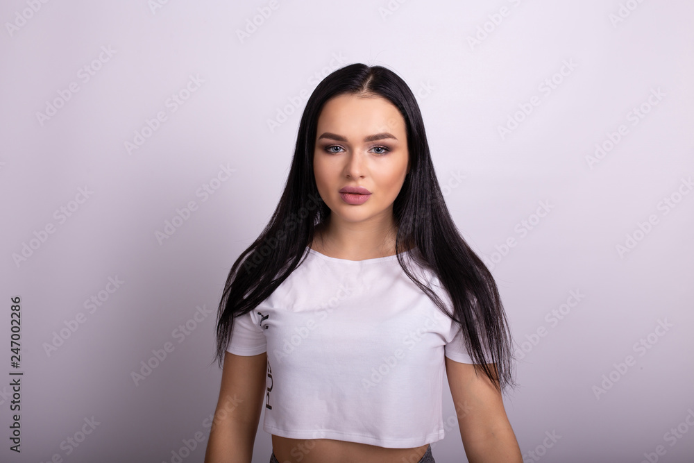 Brunette woman portrait with plump lips. Isolated on white background, copyplace, space for text Brunette woman portrait with plump lips. Isolated on white background, copyplace, space for text