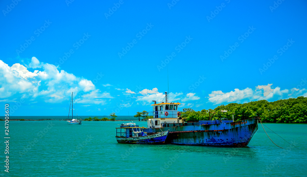 .Fishing boat mooring at the Porto Seguro coast, in the state of Bahia, Brazil. .Fishing boat mooring at the Porto Seguro coast, in the state of Bahia, Brazil.