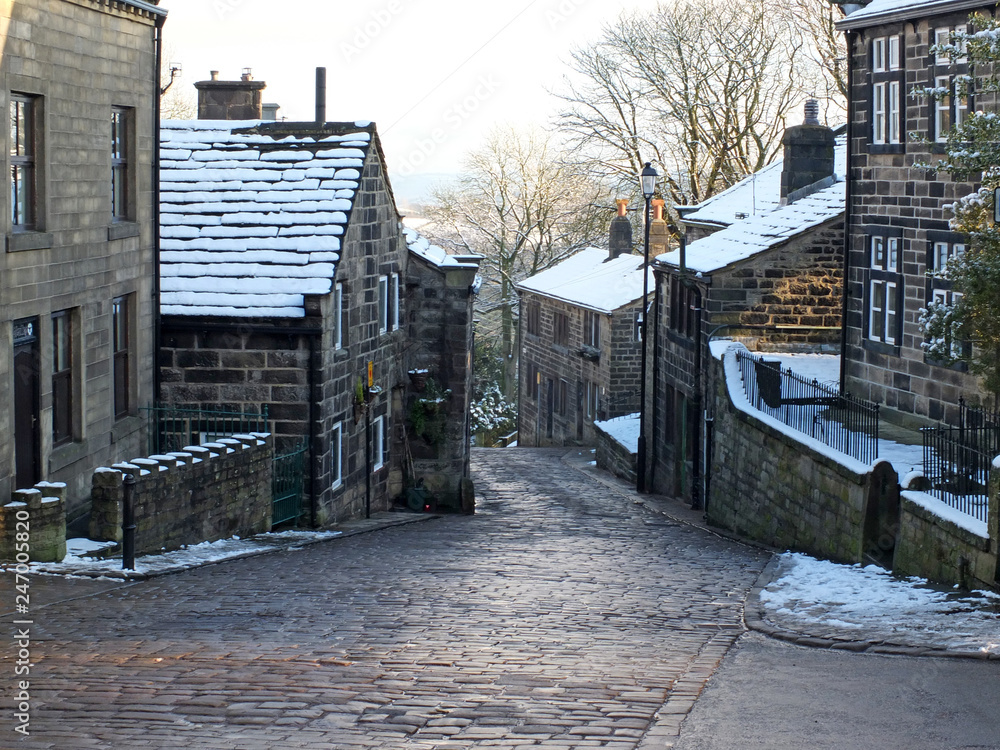 the historic yorkshire village of heptonstall in winter with snow covered roofs and street the historic yorkshire village of heptonstall in winter with snow covered roofs and street