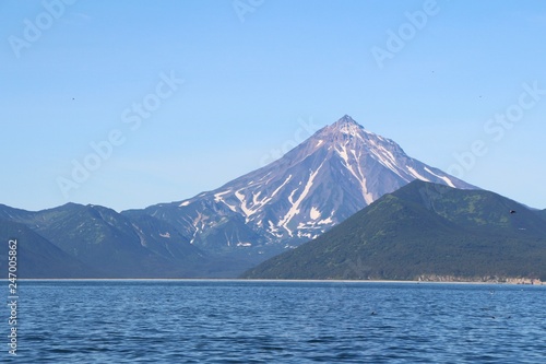 View of Vilyuchinsky volcano  also called Vilyuchik  from tourist boat. It s a stratovolcano in the southern part of Kamchatka Peninsula  Russia.