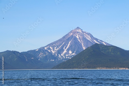 View of Vilyuchinsky volcano  also called Vilyuchik  from tourist boat. It s a stratovolcano in the southern part of Kamchatka Peninsula  Russia.