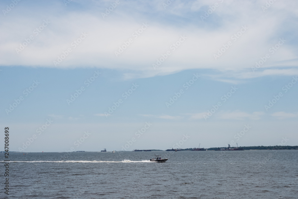 On a sunny day, yachts are sailing in the ocean. Charleston, South Carolina / USA - July 21, 2018