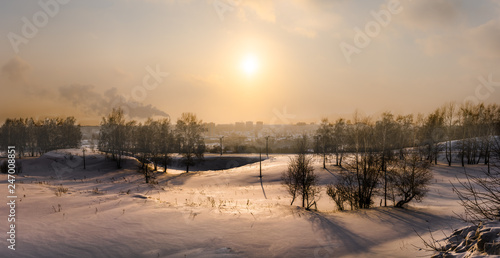 winter landscape with the fiery sun