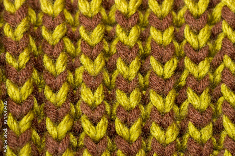 Knitting. Background knitted texture. Bright knitting needles.