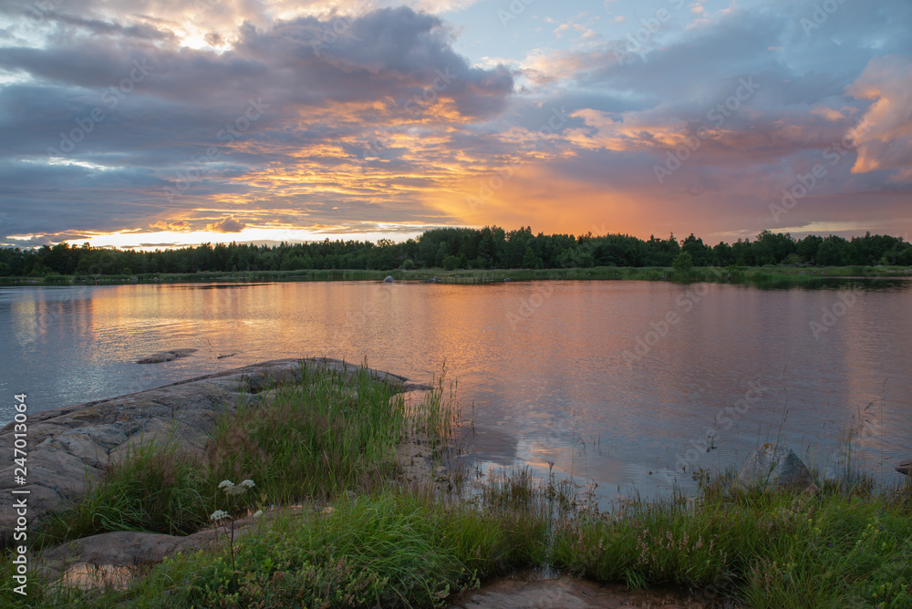 Fototapeta premium Scenic view of a rocky coast in sunset