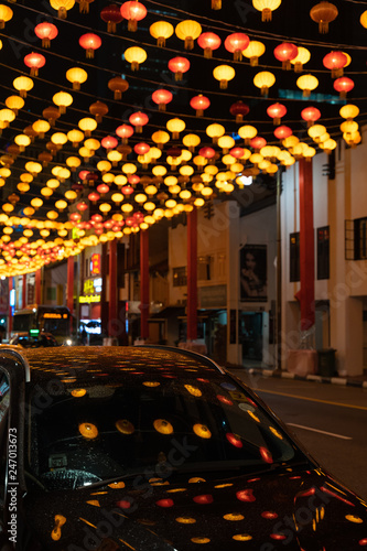 Traditional Chinese street lanterns decorations on a street of Singapore's Chinatown for Chinese New Year celebration photo