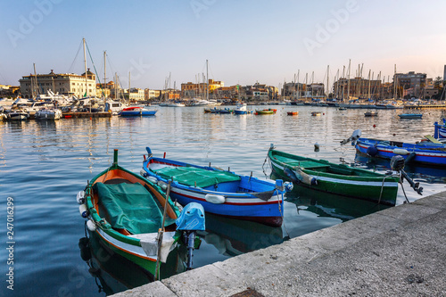 Beautiful view of the port with yachts and old color boats. photo