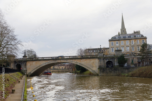 The river Avon in Bath UK and a bridge and buildings