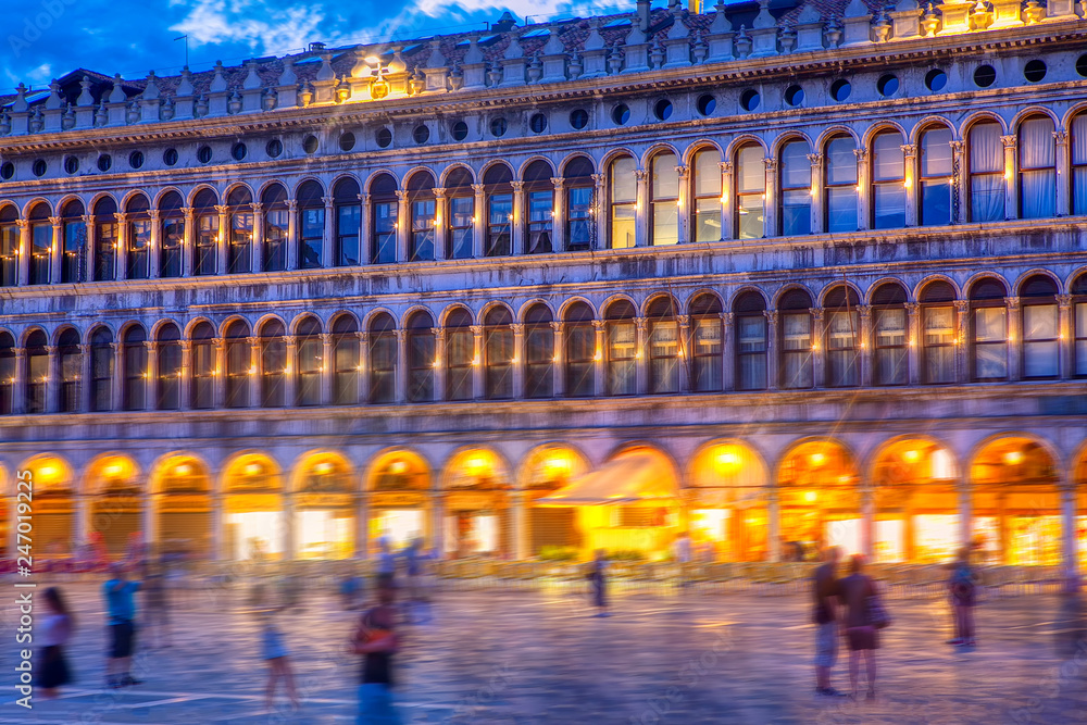 Piazza San Marco at evening and blurred people 