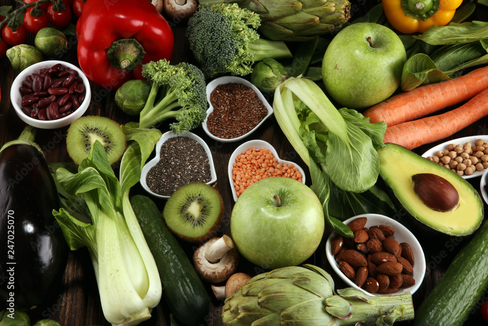 Healthy food clean eating selection. fruit, vegetable, seeds, superfood, cereals, leaf vegetable on rustic background Healthy food clean eating selection. fruit, vegetable, seeds, superfood, cereals, leaf vegetable on rustic background
