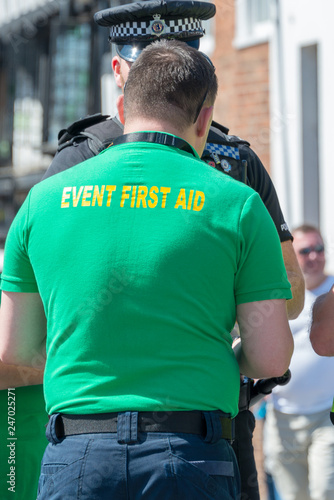 event first aider talking to British policeman in the UK