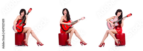 Fototapeta Naklejka Na Ścianę i Meble -  Woman in red dress playing guitar isolated on the white