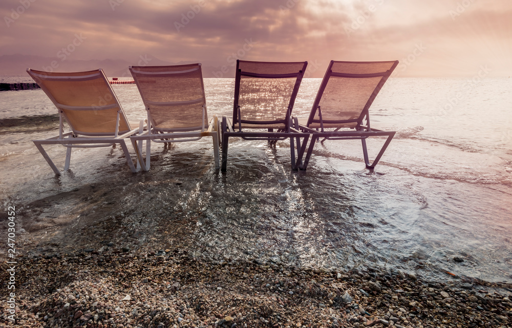 Morning on central public beach of Eilat - famous tourist resort and recreational city in Israel and Middle East Morning on central public beach of Eilat - famous tourist resort and recreational city in Israel and Middle East