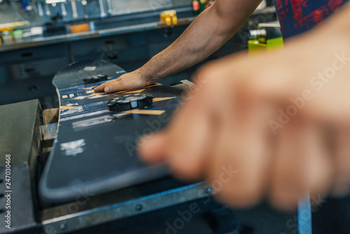 Maintenance of Snowboard. Specialist in Snowboard, repairing a Snowboard in his workshop