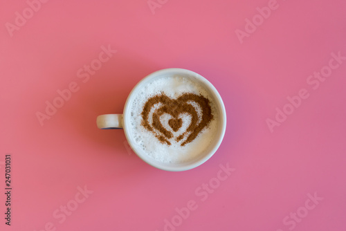 Heart Shape Coffee Cup Concept isolated on pink background. love cup , heart drawing on latte art coffee.