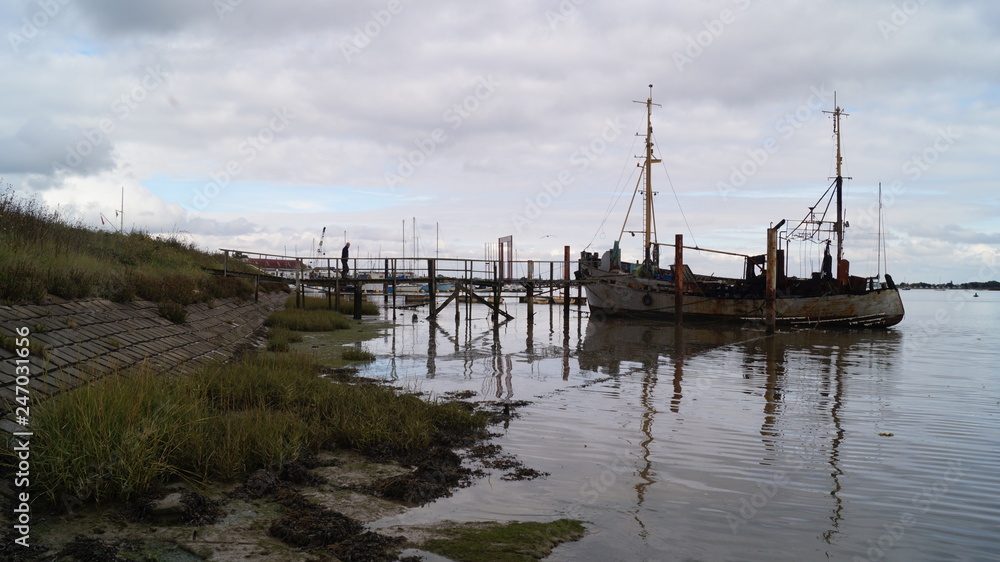 Old Wooden Yachts on Mud Flats in Essex Old Wooden Yachts on Mud Flats in Essex