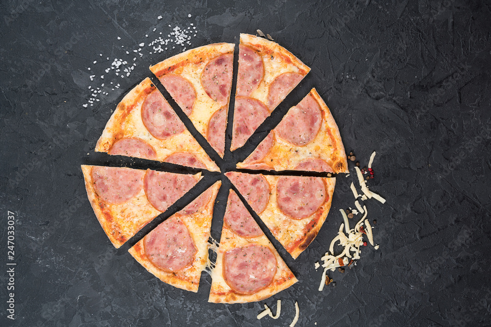 Pizza Pepperoni isolated on black background.