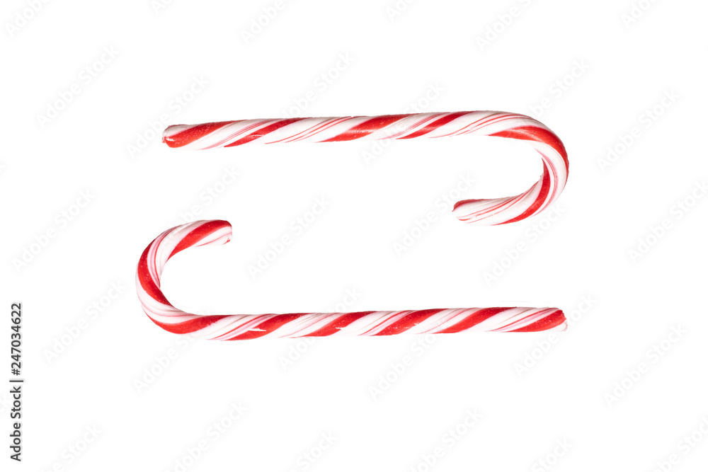 Traditional Christmas striped candy cane isolated on a white background. Top view.