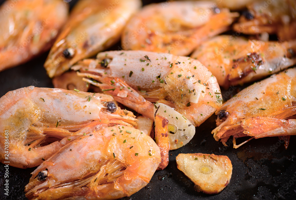 Cooking fried Shrimps on pan with spices close-up Cooking fried Shrimps on pan with spices close-up