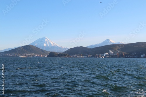 Avachinsky and Koryaksky volcanoes towers over the city of Petropavlovsk-Kamchatsky on the Kamchatka Peninsula  Russia.