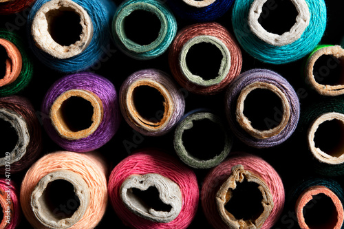 bright multi-colored spools of thread top view © Владимир Солдатов