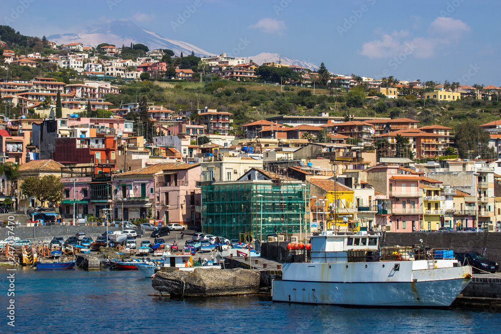 Splendid old fishing village in Sicily, Acitrezza with a view of the Volcano Etna
