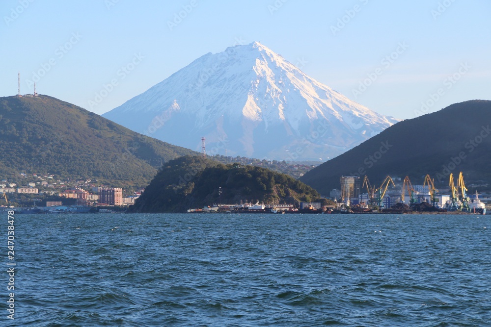 Koryaksky volcano towers over the city of Petropavlovsk-Kamchatsky. Koryaksky or Koryakskaya Sopka is an active volcano on the Kamchatka Peninsula in the Russian Far East.