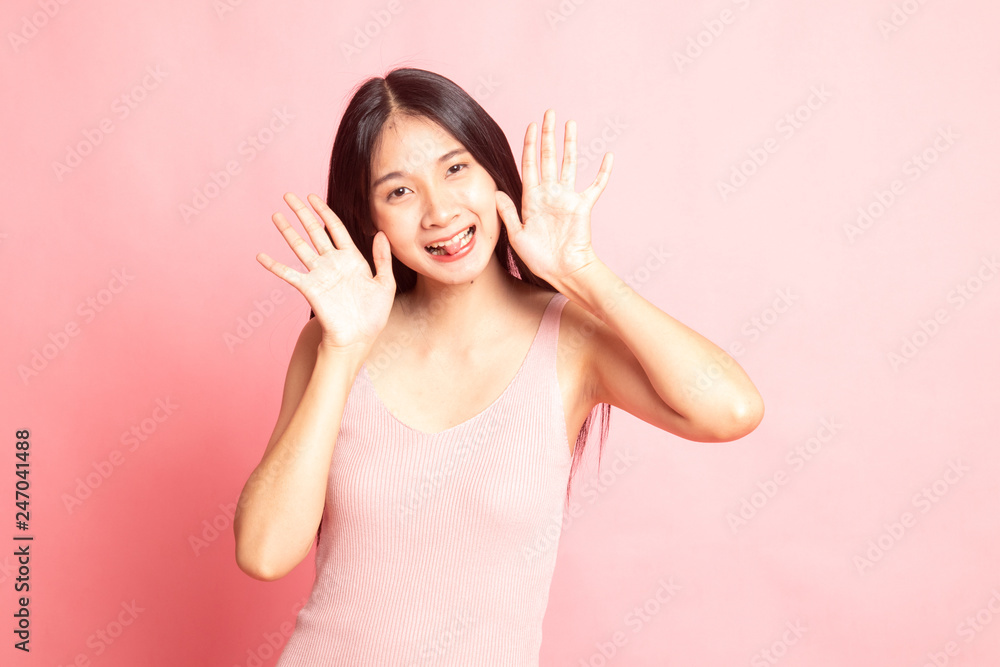 Young Asian woman sticking her tongue out. Young Asian woman sticking her tongue out.