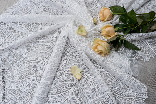 The texture of lace on wooden background decoreted roses. photo