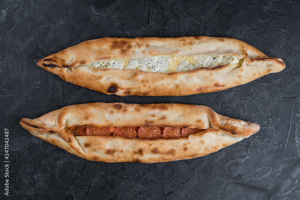 Turkish pizza is called peed, topped with baked cheese Turkish pizza is called peed, topped with baked cheese