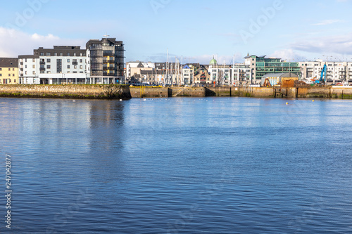 Galway harbour, Corrib river and Galway buildings with reflection © lisandrotrarbach