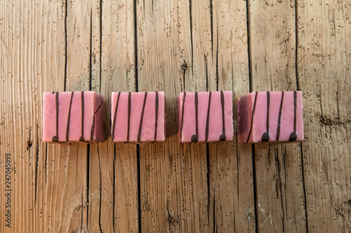 Pink punch cake on a wood Table photo