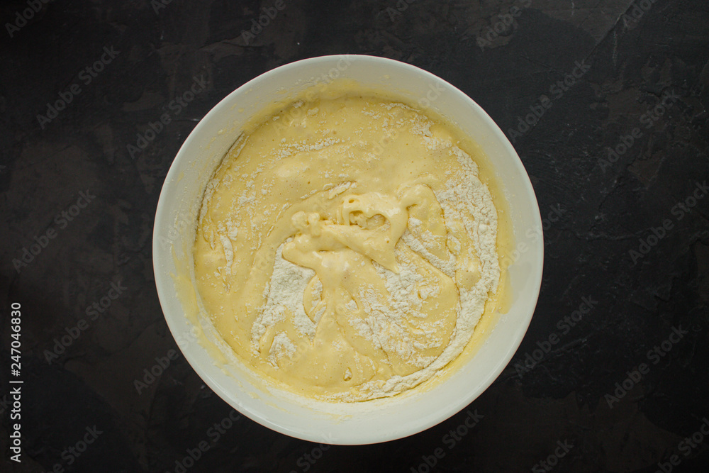 raw dough and apples (eggs, flour and other ingredients apples - Charlotte). food background. copy space raw dough and apples (eggs, flour and other ingredients apples - Charlotte). food background. copy space